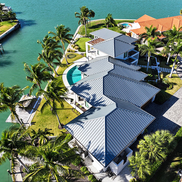 aerial view metal roof panels installed on a coastal house in florida
